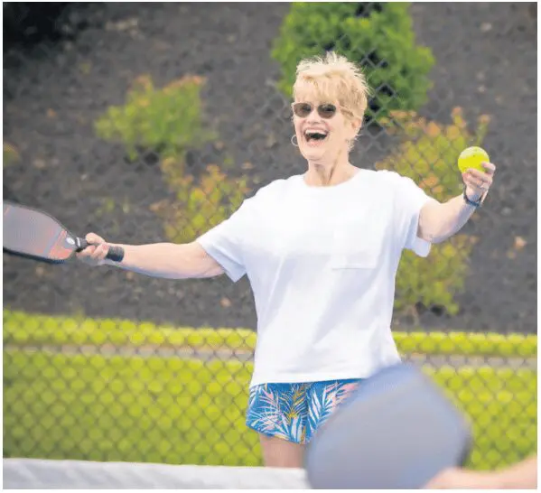 EntertainmentOptions3 Senior woman playing tennis