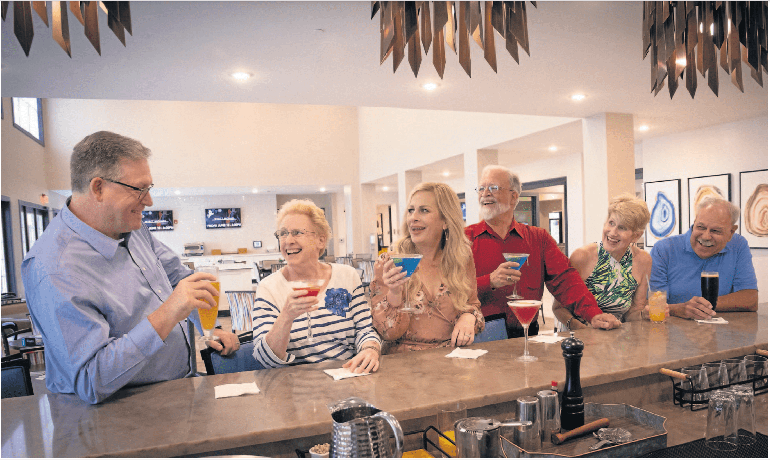 Seniors enjoying drinks at a private bar