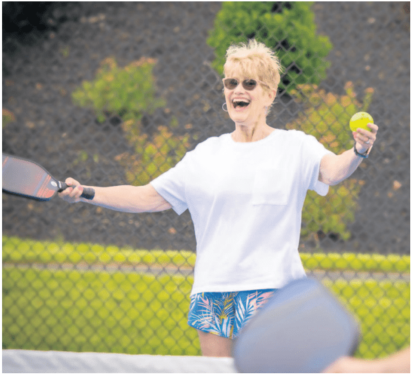 Senior woman playing tennis